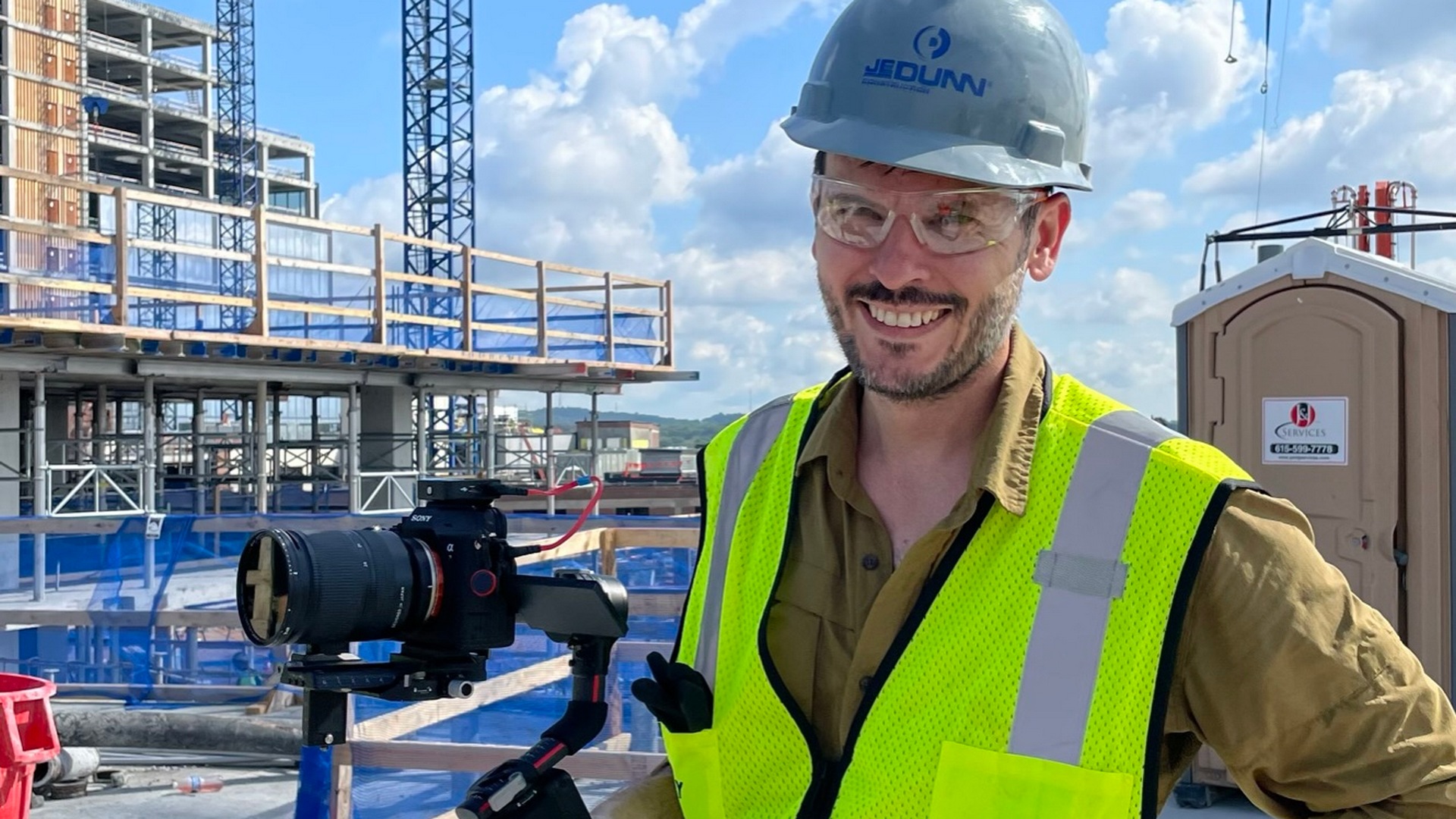Camera operator at a construction site